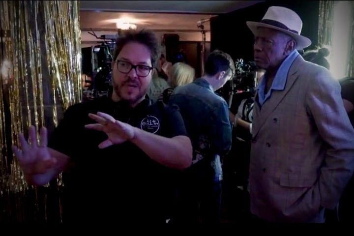 Sergio Navarretta directing a cast member on the set of The Cuban